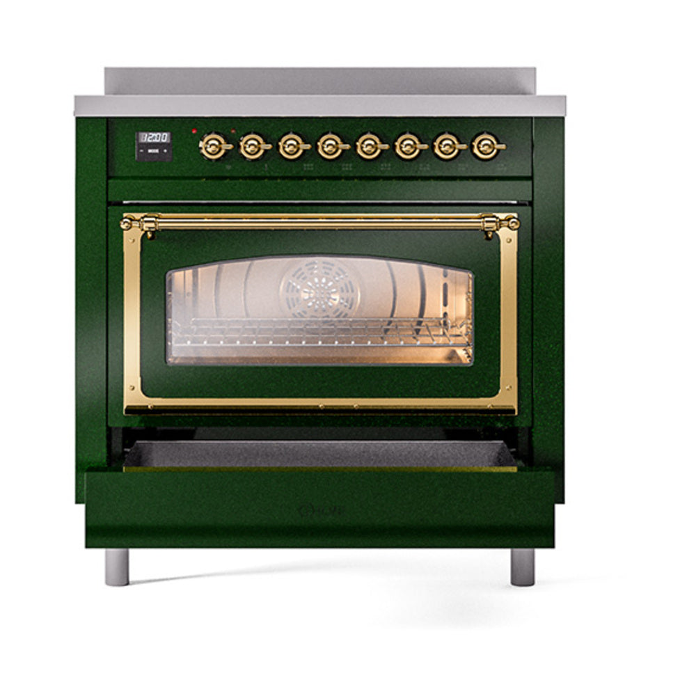 Emerald green induction range with glowing glass oven window and brass handle