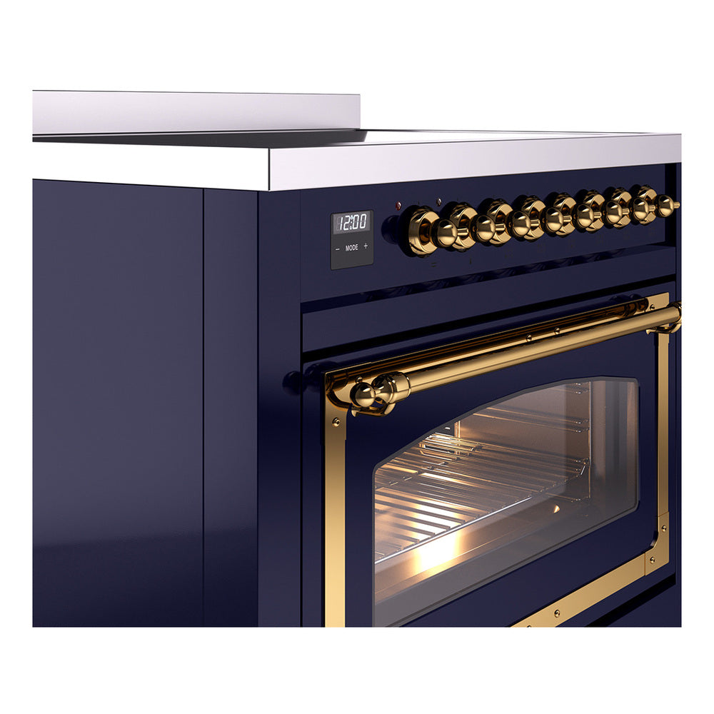 Midnight blue induction range with brass-trim control knobs and oven door window