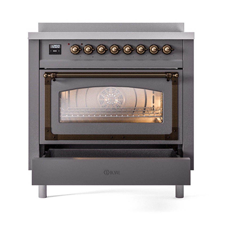 Matte graphite induction range with triple-glass oven door and bronze-trim knobs