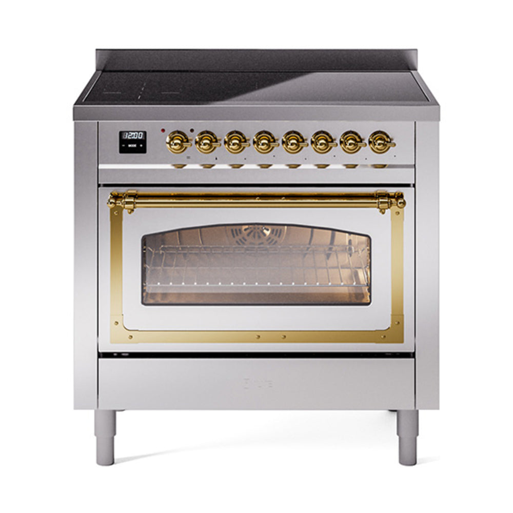 Stainless induction range with triple glass oven door and brass handle, front view