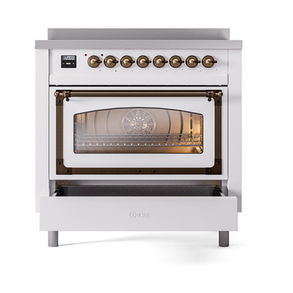 White induction range with bronze knobs, open oven door, storage drawer