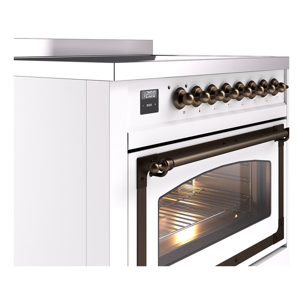 White induction range with bronze control knobs and oven door glass