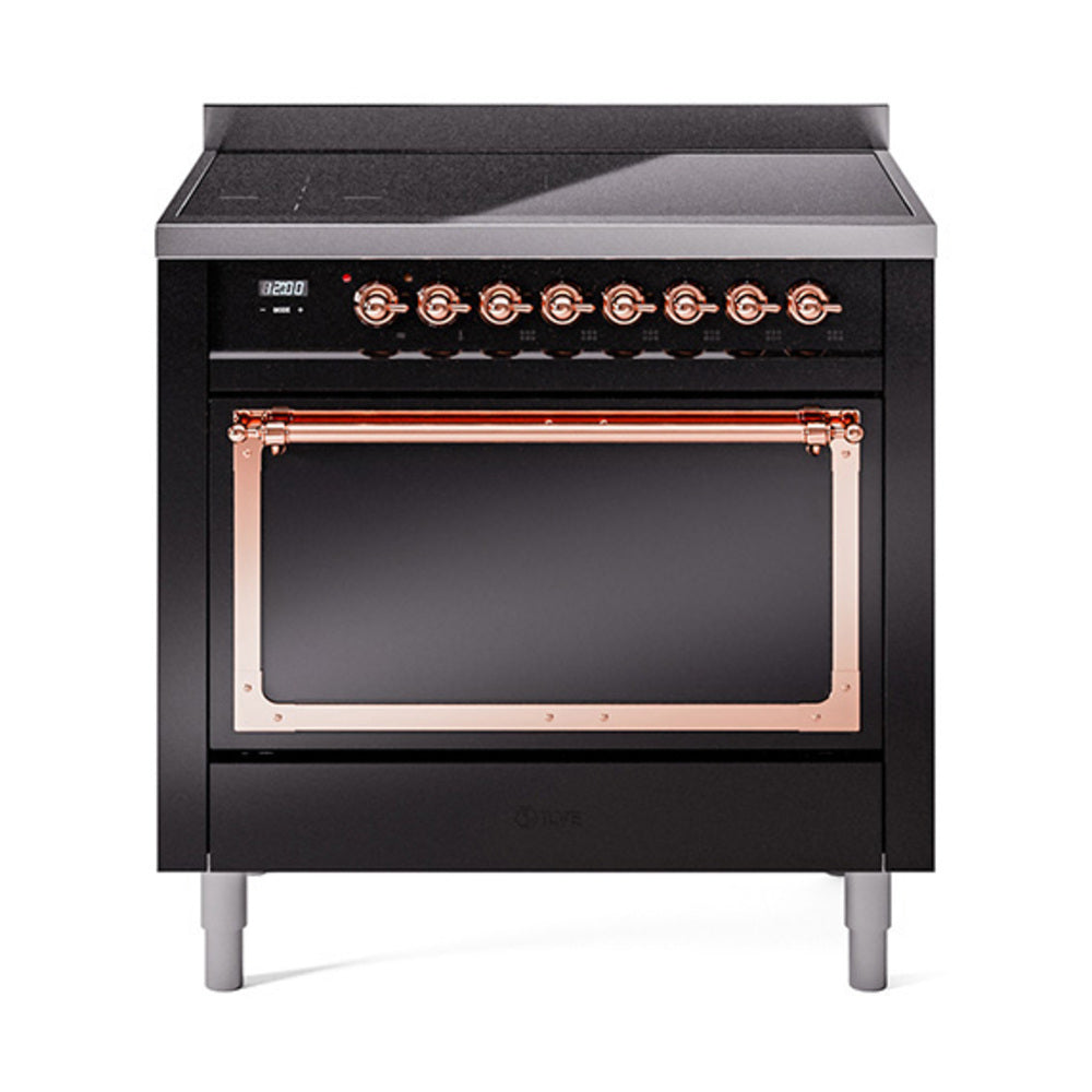 Black induction range with open oven door and copper trim across the top bar