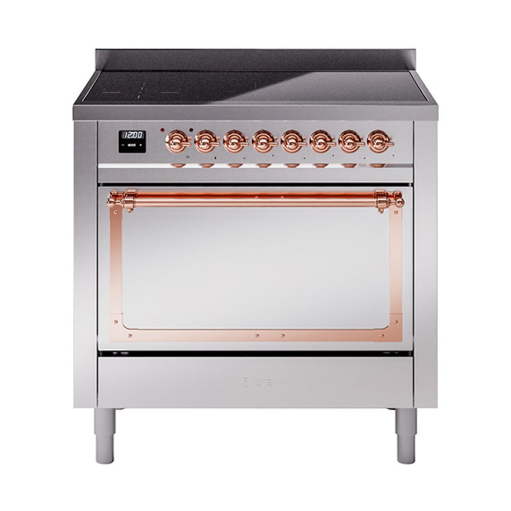 Stainless steel induction range front with copper-trimmed knobs and oven window