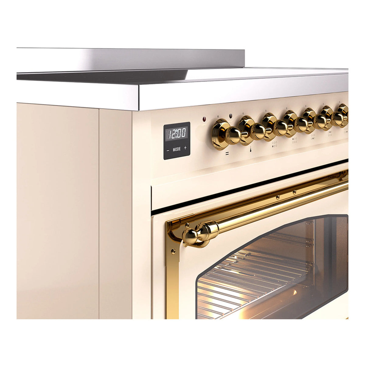 Antique white induction range detail: brass control knobs and oven door handle.