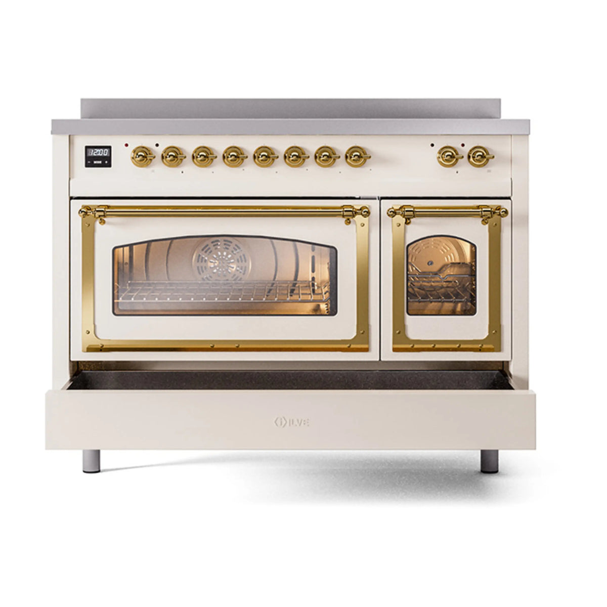 Antique white induction range with brass trim, triple glass doors with oven interior lit.