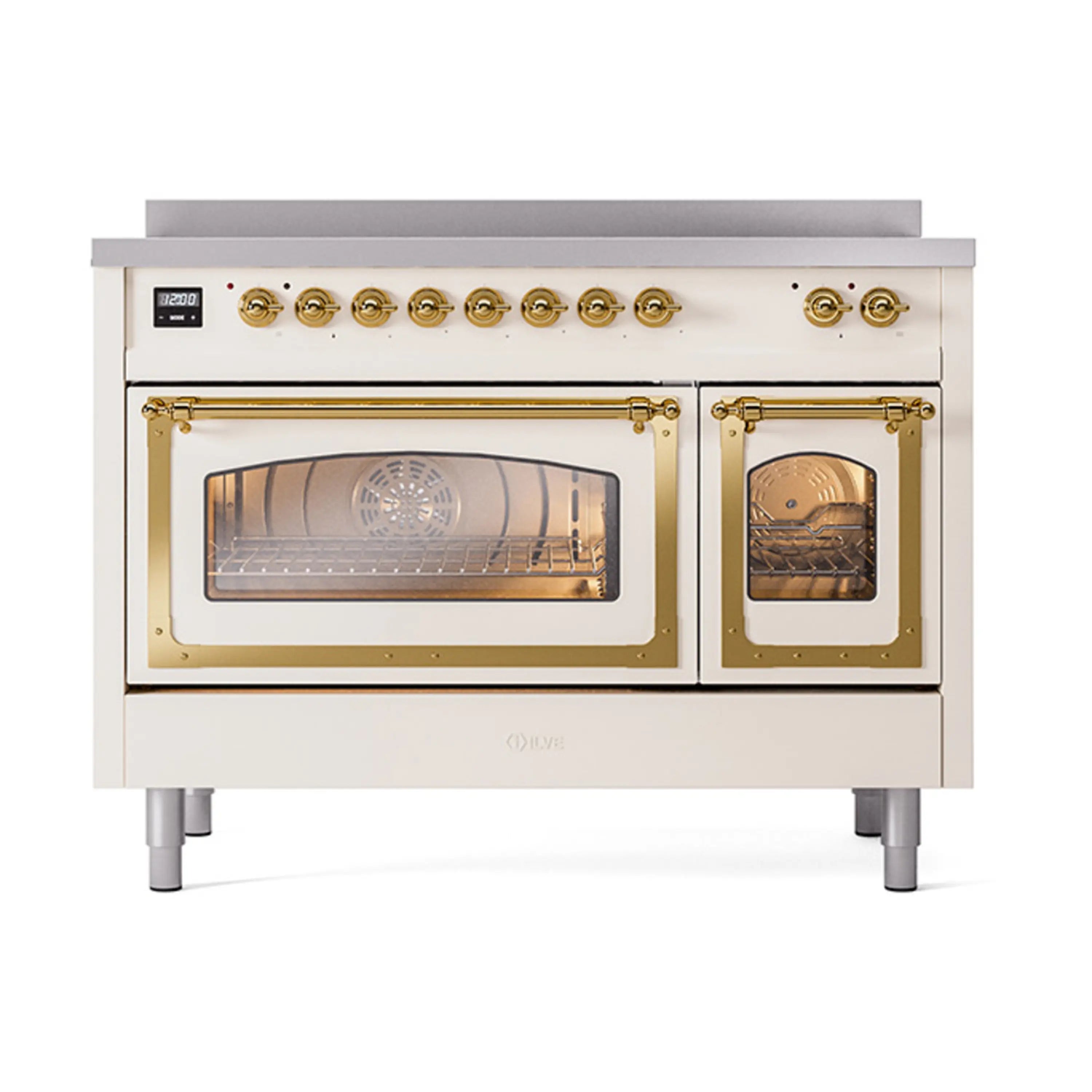 Antique white induction range with brass trim, triple glass oven doors, front controls.