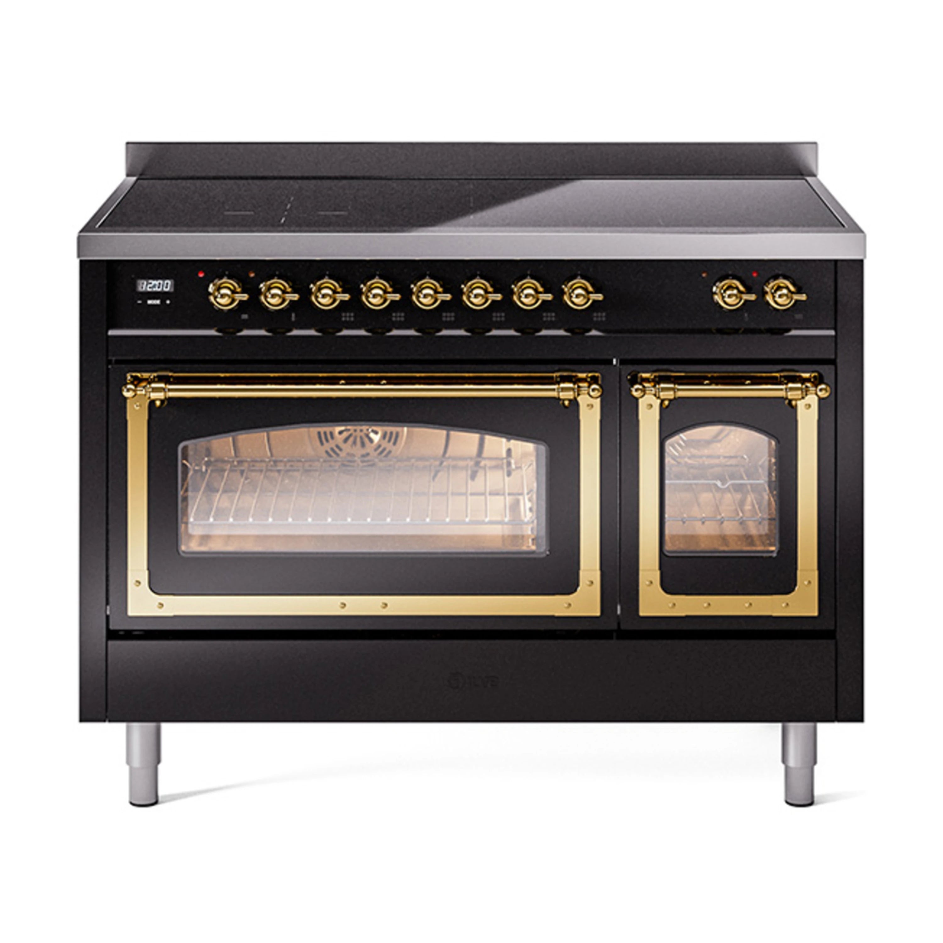 Glossy black induction range with brass-trimmed doors and control knobs, angled view