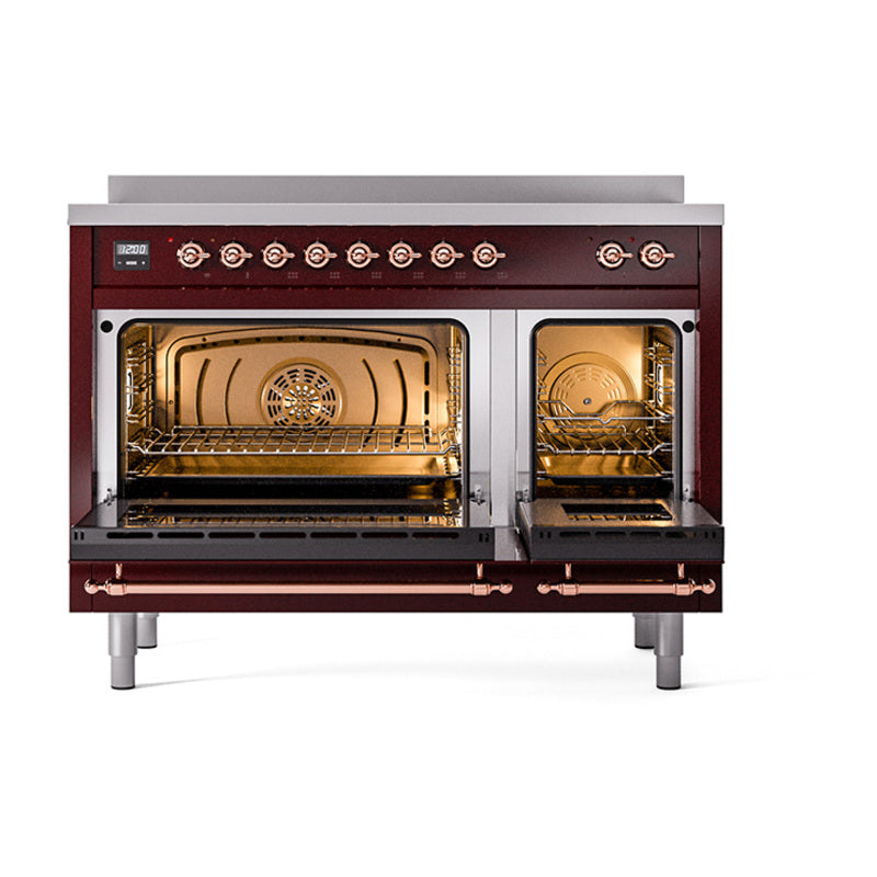 Burgundy induction range with both oven compartments open, copper trim and racks visible