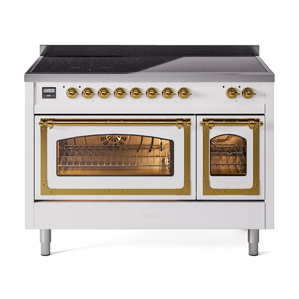 White induction range front view with brass controls and dual glass oven doors