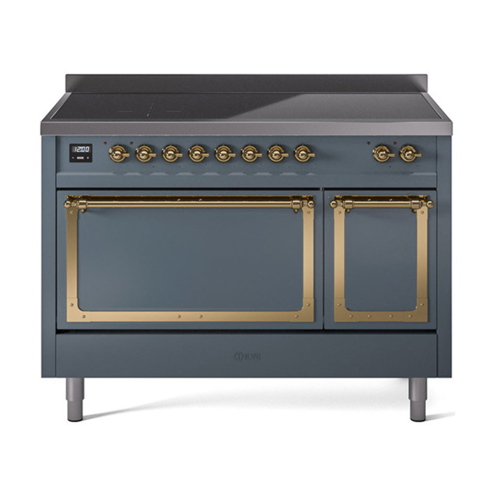 Blue grey induction range with brass-trimmed knobs and dual oven doors closed