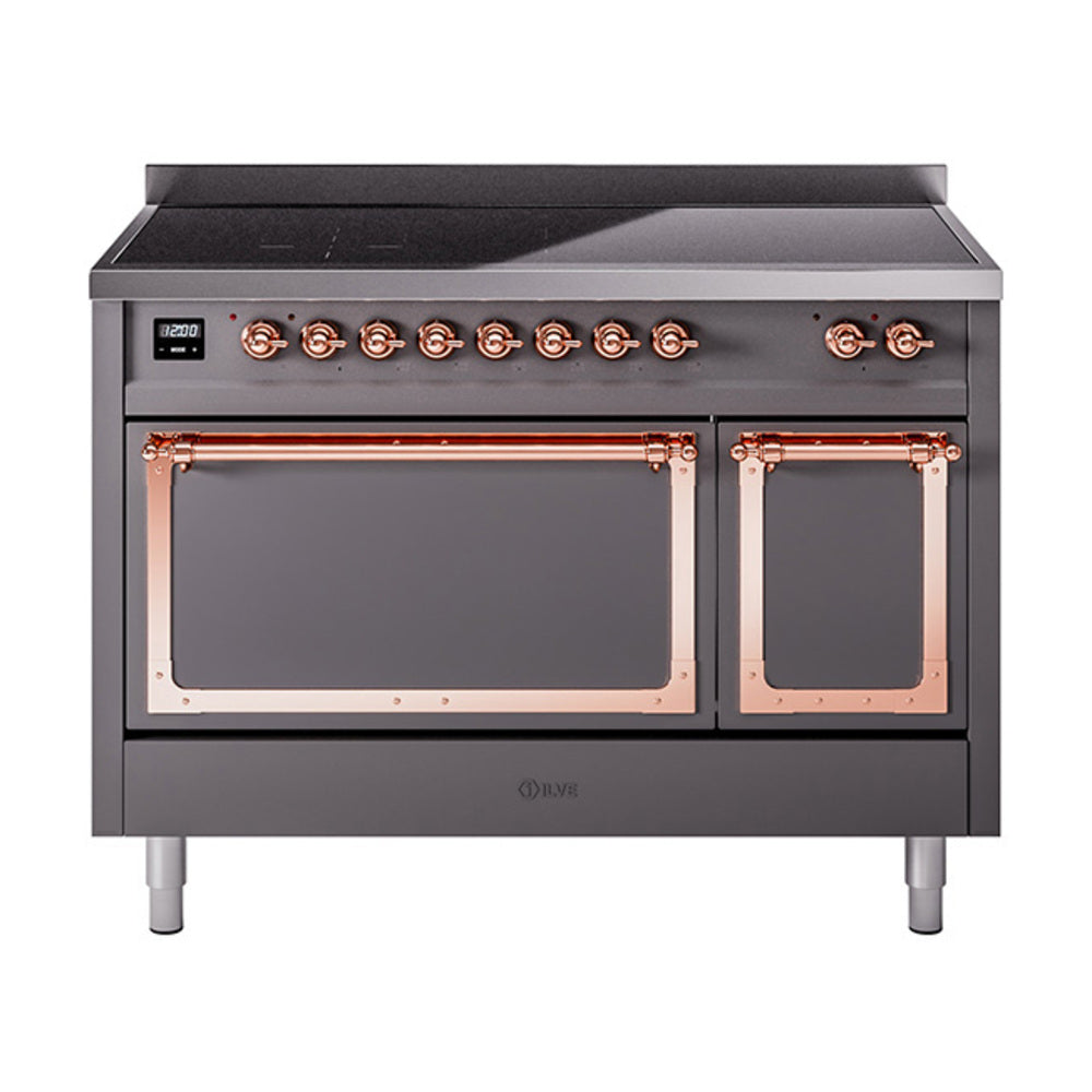 Induction range with front knobs, copper trim, and two closed oven doors