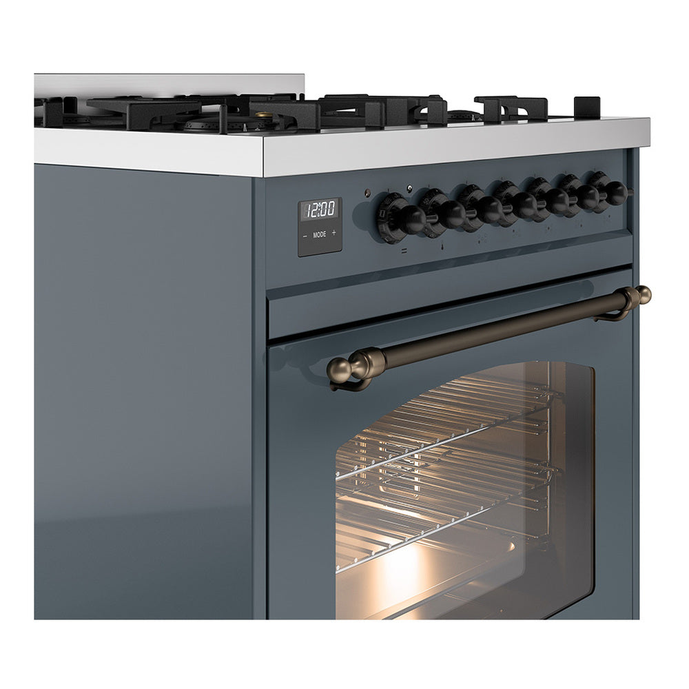 Blue-grey dual fuel range with bronze handle, control knobs, and lit oven interior