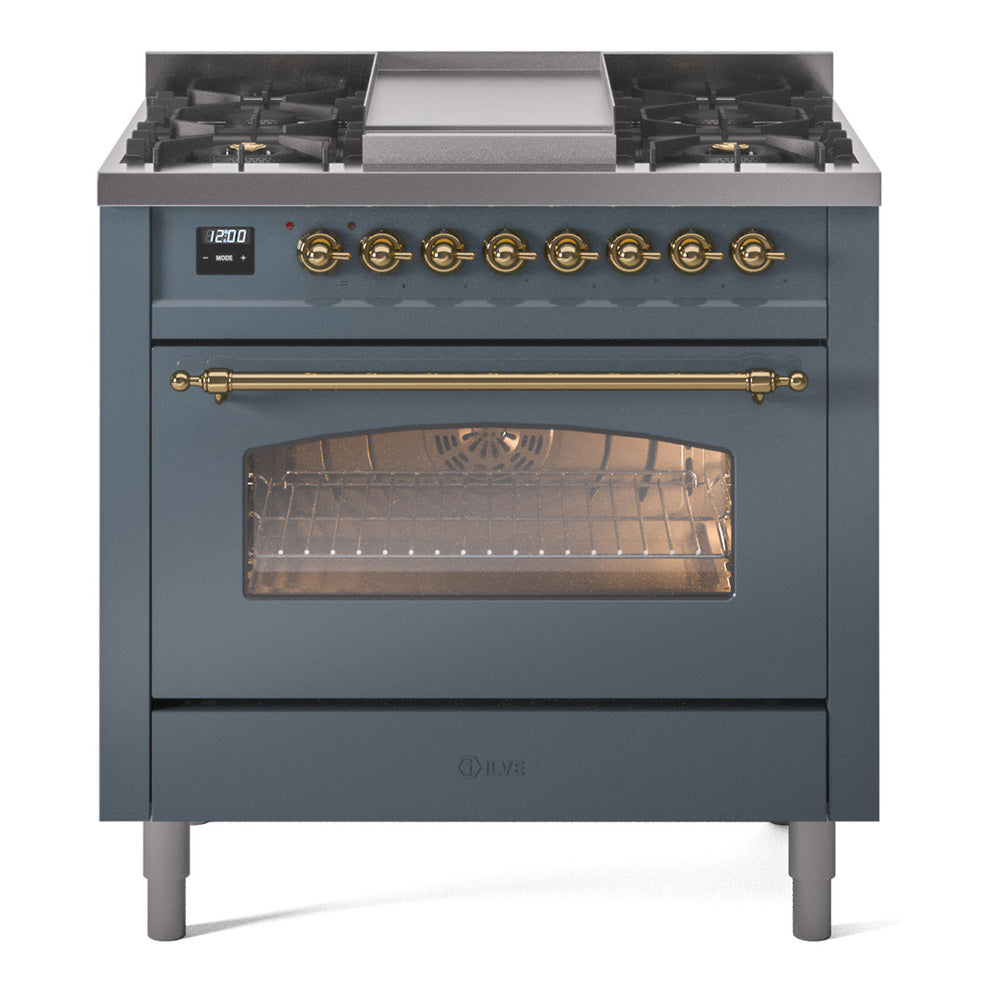 Blue grey dual fuel range with brass trim and lit oven interior through window