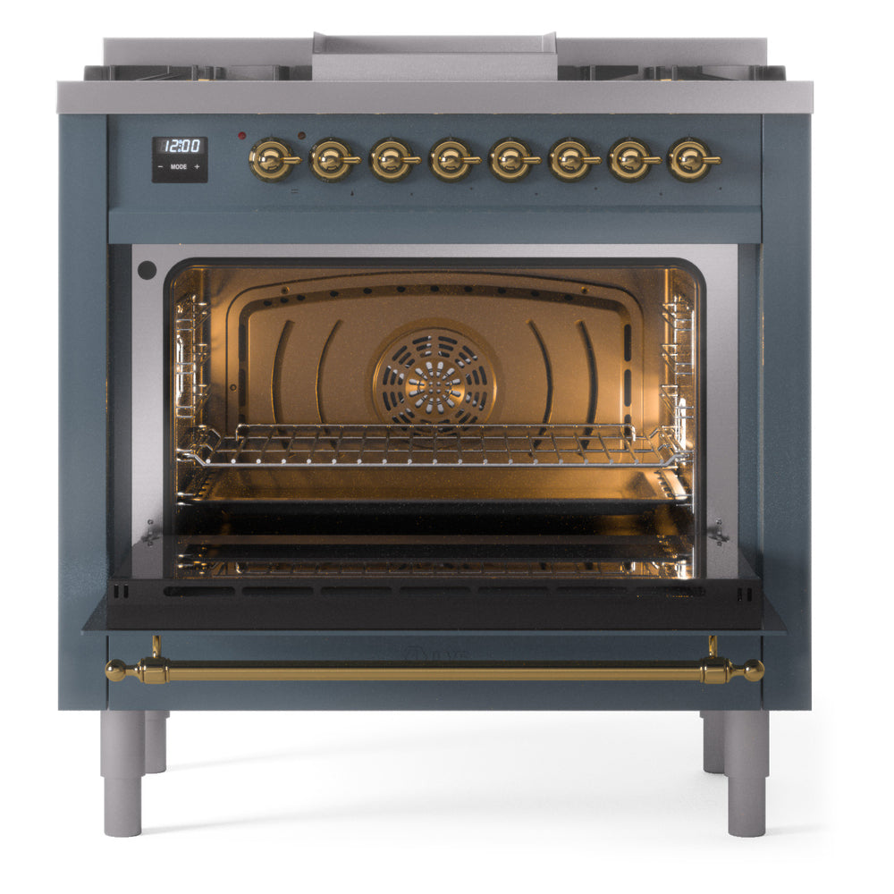 Freestanding dual fuel range with brass trim, open oven cavity, and glowing interior