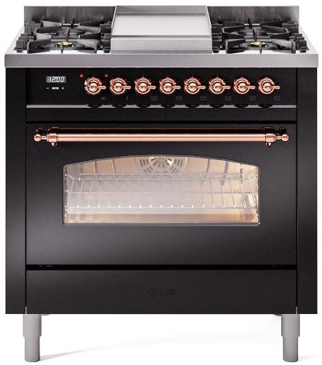 Freestanding black range with copper knobs, open glass oven door, and front cooktop grates