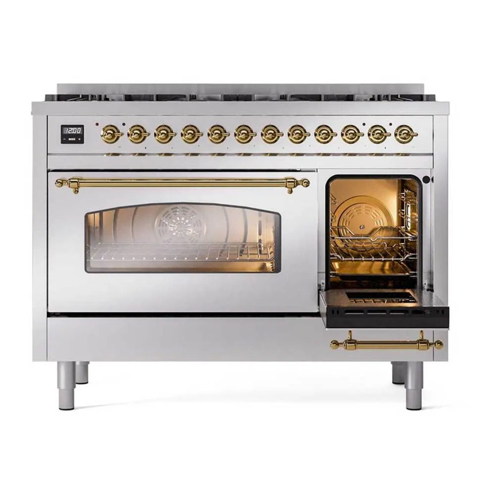 Stainless dual fuel range with open oven door showing lit interior and brass handle trims