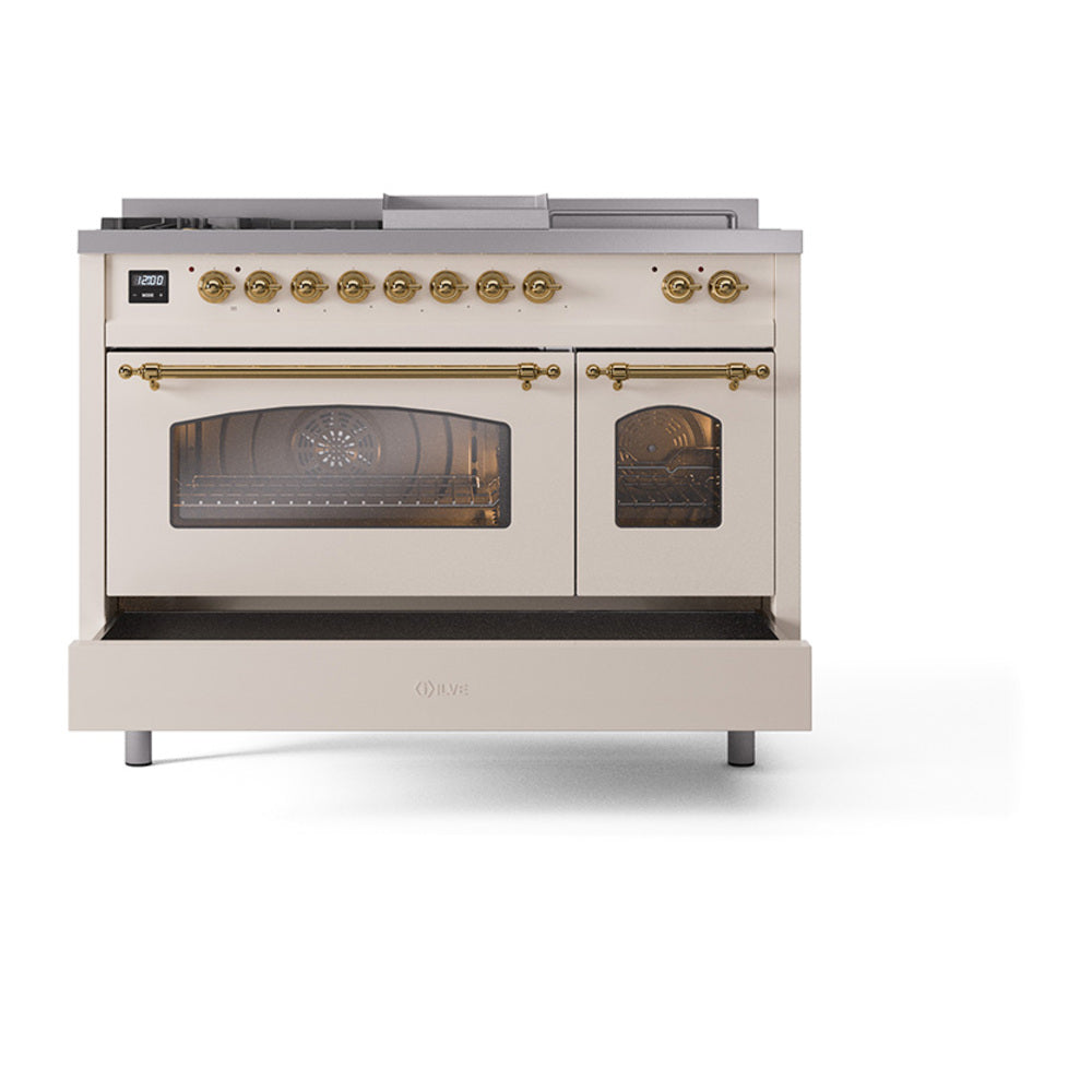 Antique white dual fuel range with brass-trim knobs and two glass-front ovens