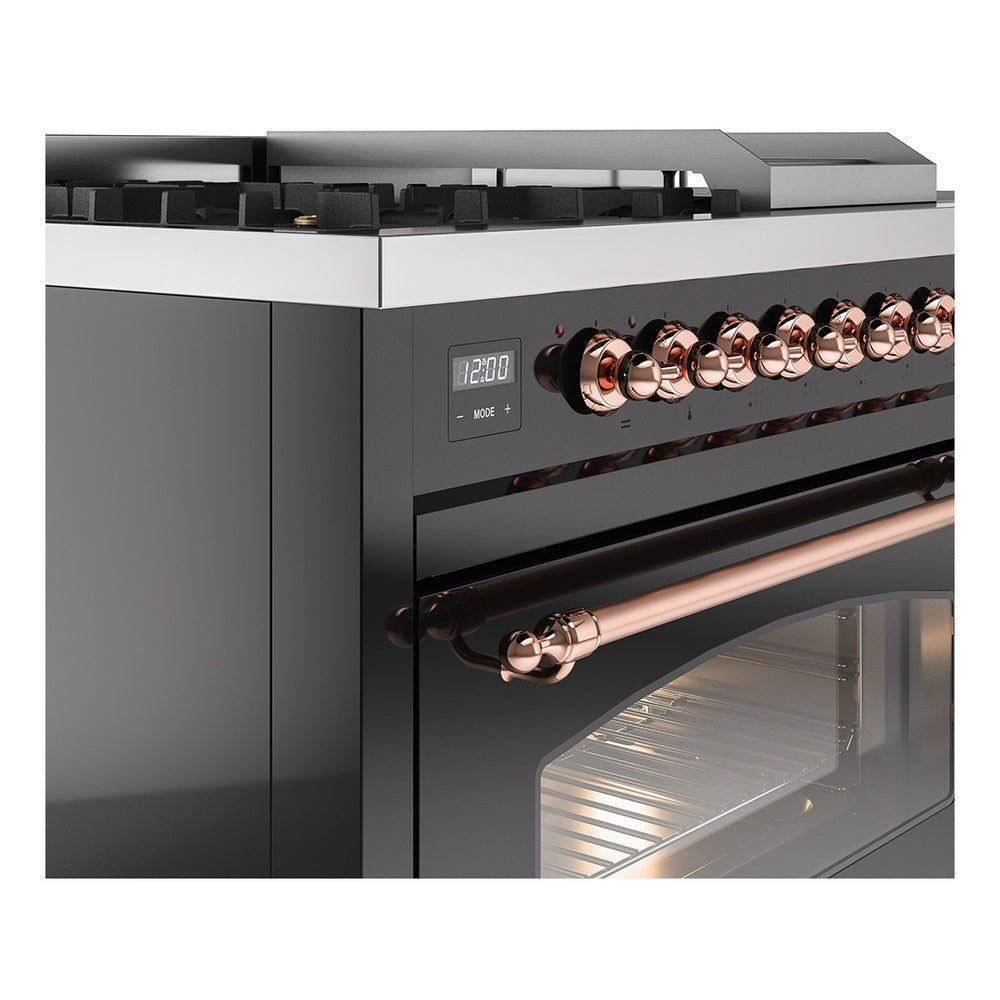 Close-up of glossy black range with copper control knobs, trim, and oven door glass