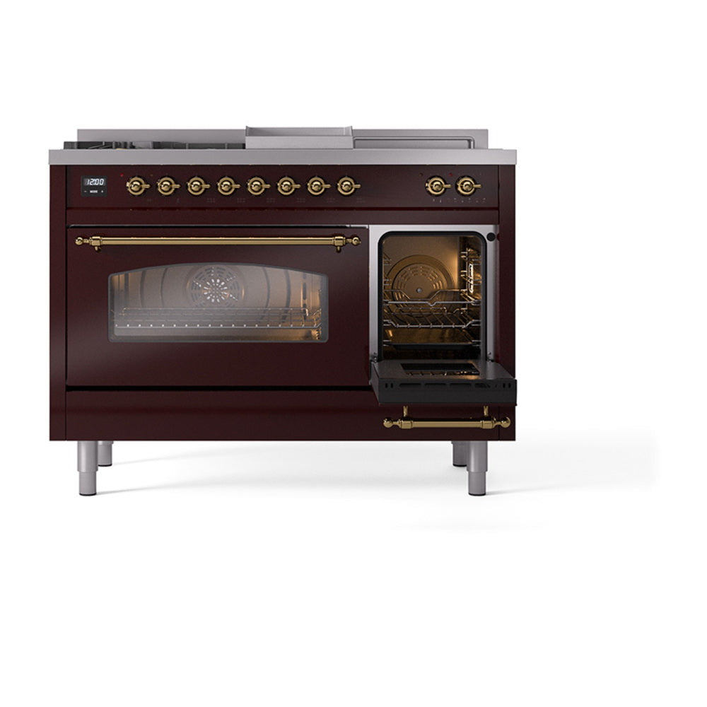 Burgundy dual oven range with brass handles; right oven door open with visible racks
