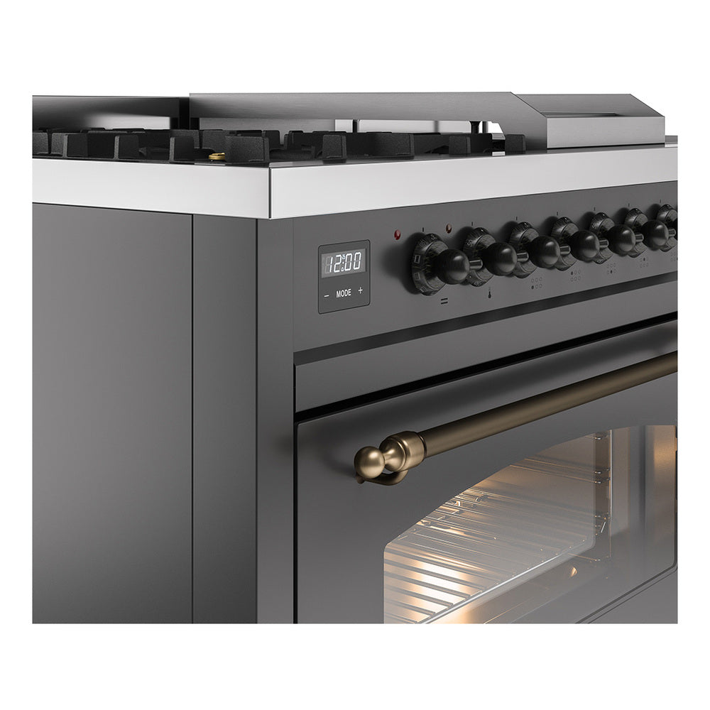 ILVE dual fuel range control panel close-up with knobs and lit oven window