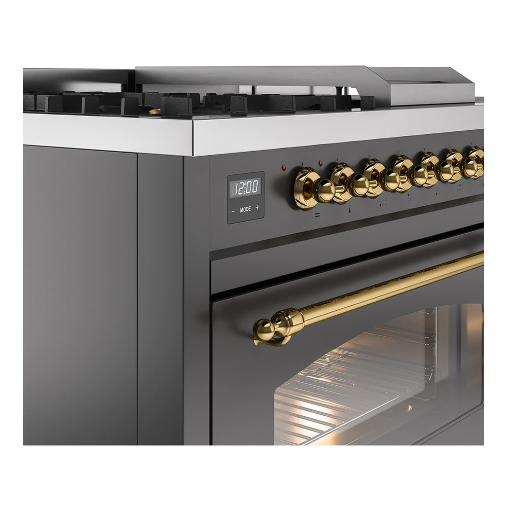 Matte graphite oven front with brass control knobs, display, and oven window