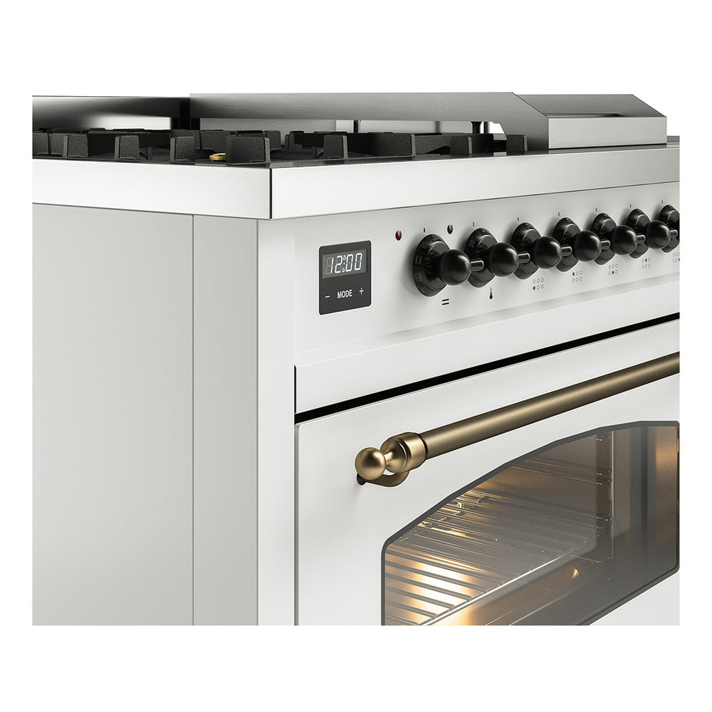 White dual-fuel gas range close-up: control knobs, bronze handle, and oven window