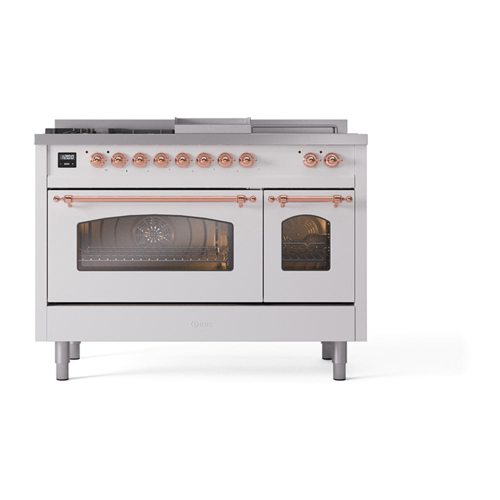 White dual-fuel range with glass oven doors, copper accents, and control knobs.