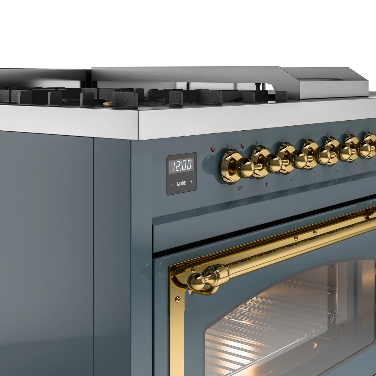 Dual fuel gas range control panel with brass knobs and windowed oven door, blue gray
