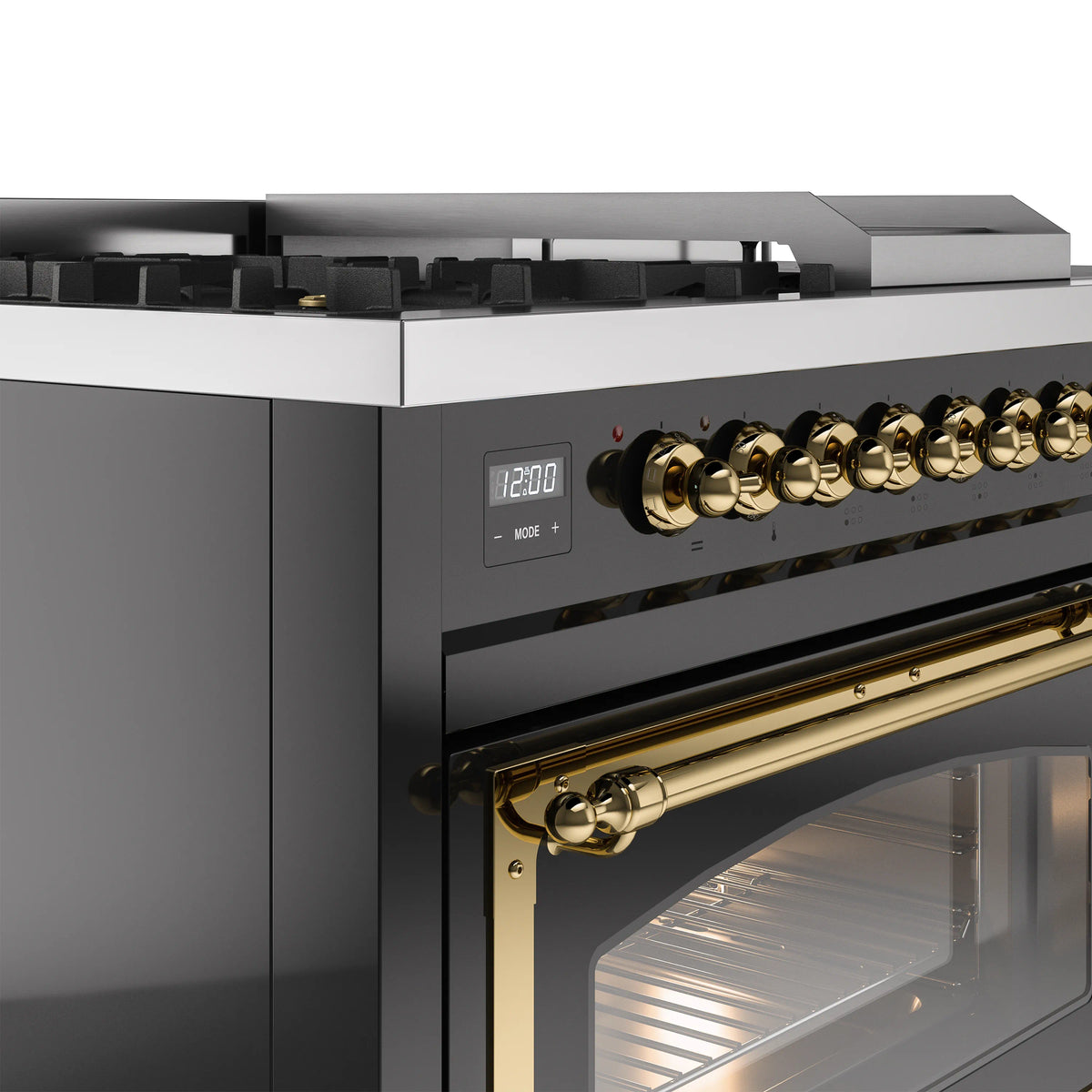 Close-up of glossy black control panel with brass knobs and gold-trimmed oven door.