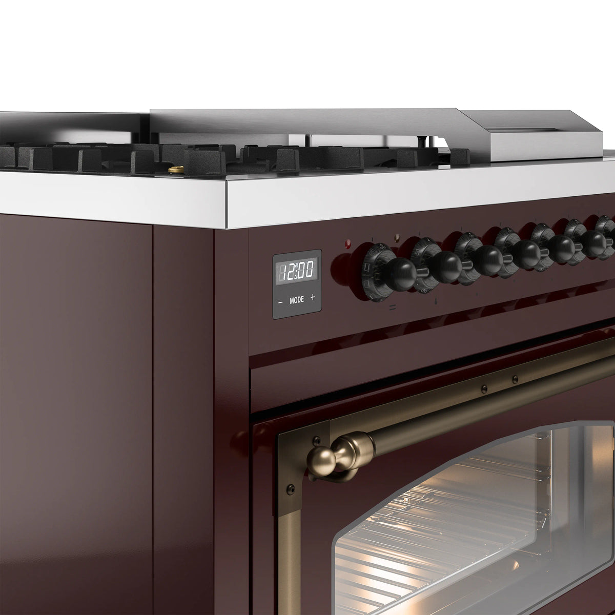 Burgundy gas range control panel with black knobs and bronze handle, close-up