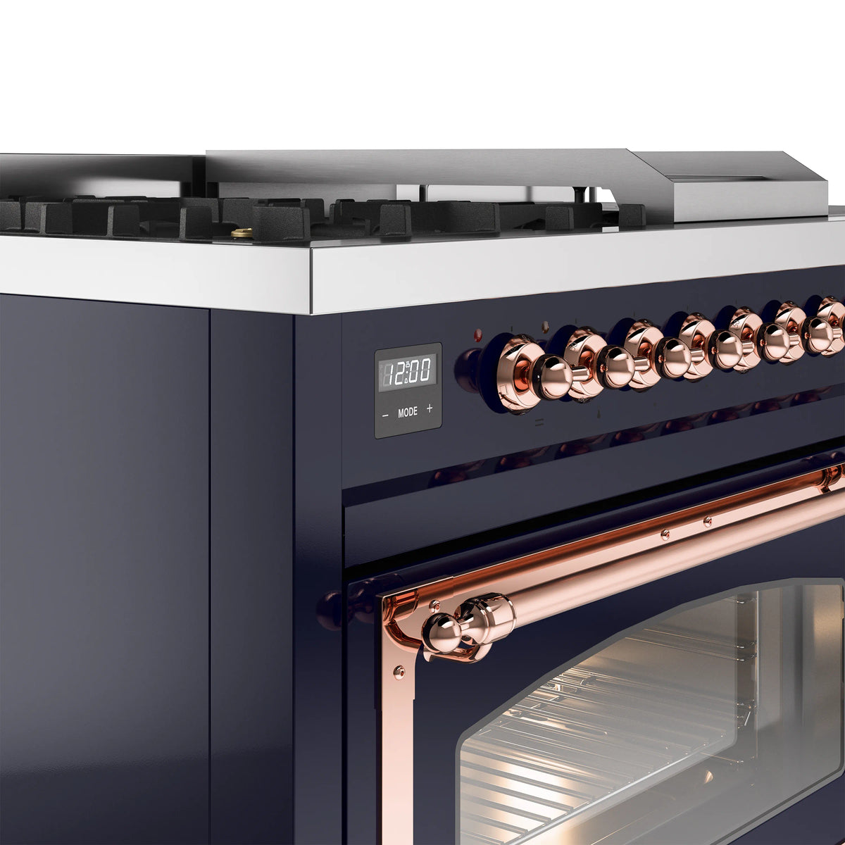 Control panel and copper knobs on a midnight blue dual-fuel freestanding range