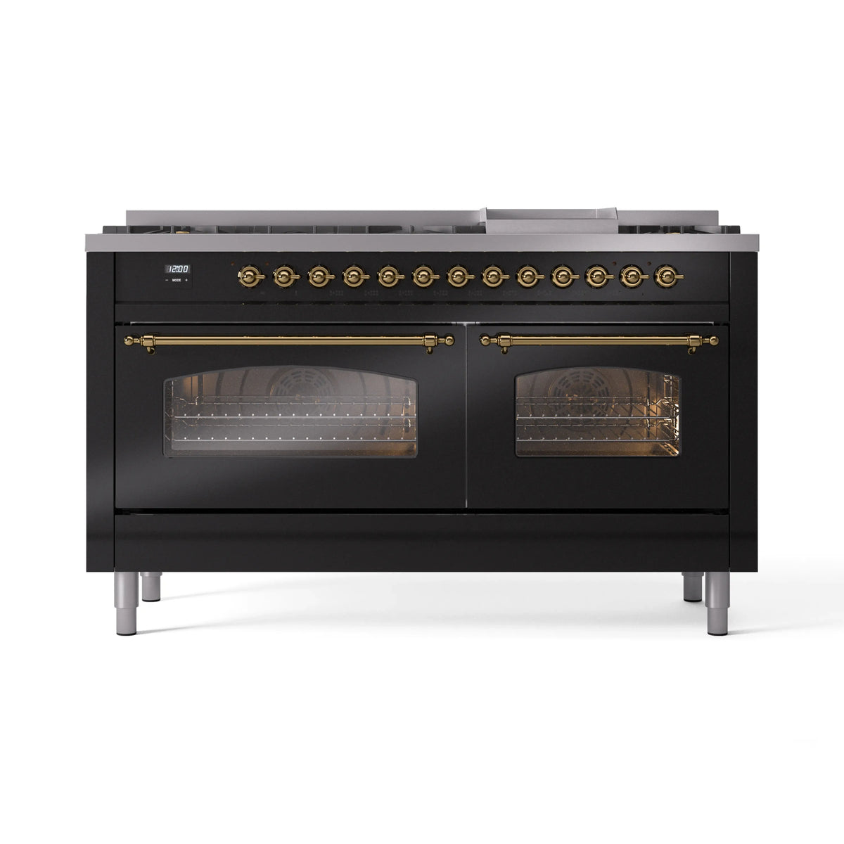 Glossy black dual-fuel range front with brass trim, glass oven doors, and closed grates