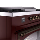 ILVE 60-Inch Nostalgie II Noblesse Natural Gas Dual Fuel Range with 7 Sealed Burners, Griddle, French Top and Triple Glass Door Oven in Burgundy with Bronze Trim (UN60FSNMPBUB)