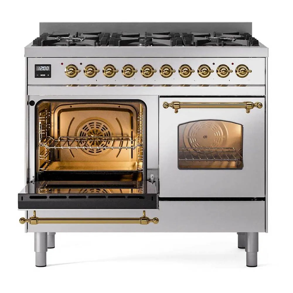 Stainless dual-fuel range with open oven on left and brass control panel
