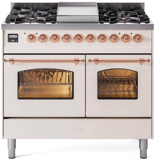 Antique white dual fuel range with four stovetop burners, copper controls, two oven windows
