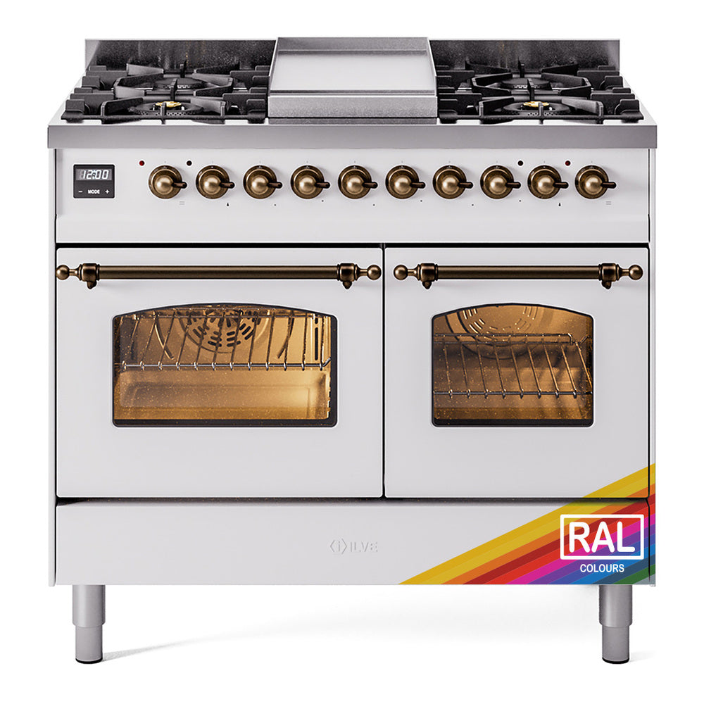 Dual fuel freestanding range front with brass burner knobs and two glass oven doors