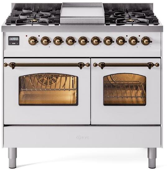 White dual-fuel range with brass knobs, four burners, and two oven doors