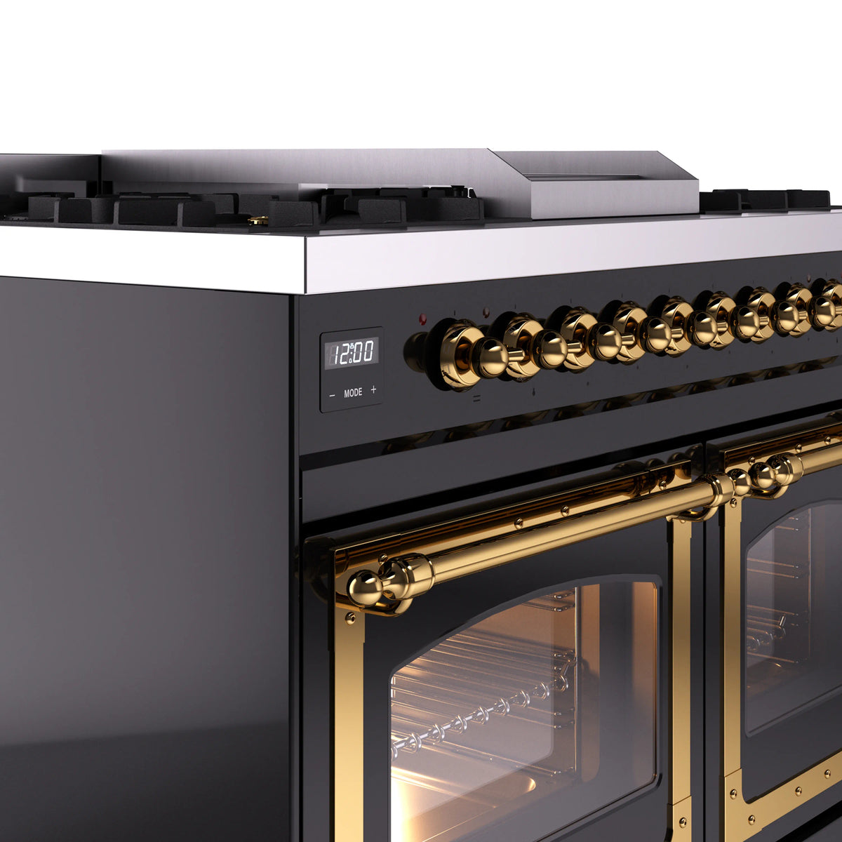 Black range control panel with brass knobs and oven door window trim