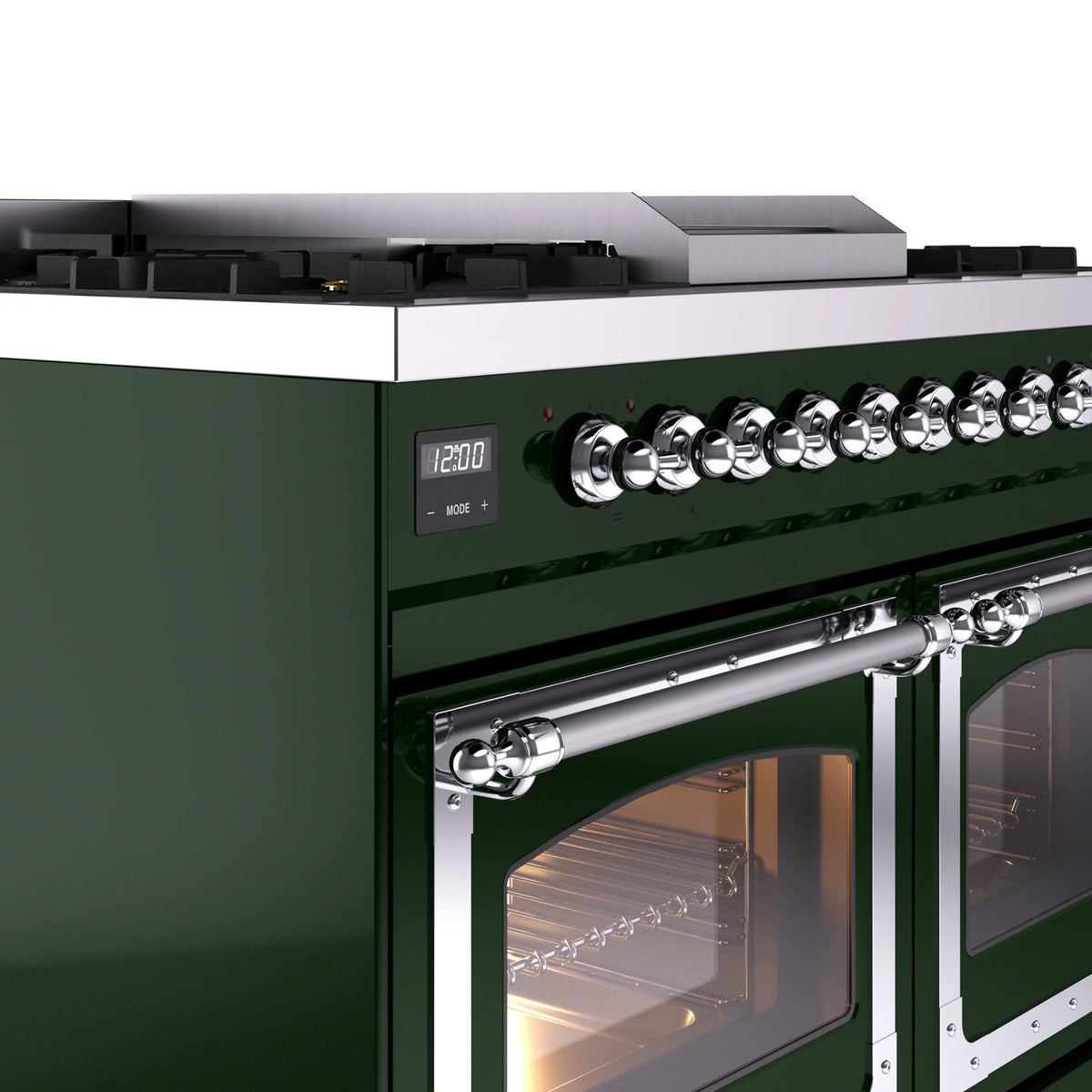 Chrome control knobs and handle on an emerald green range with an oven door open