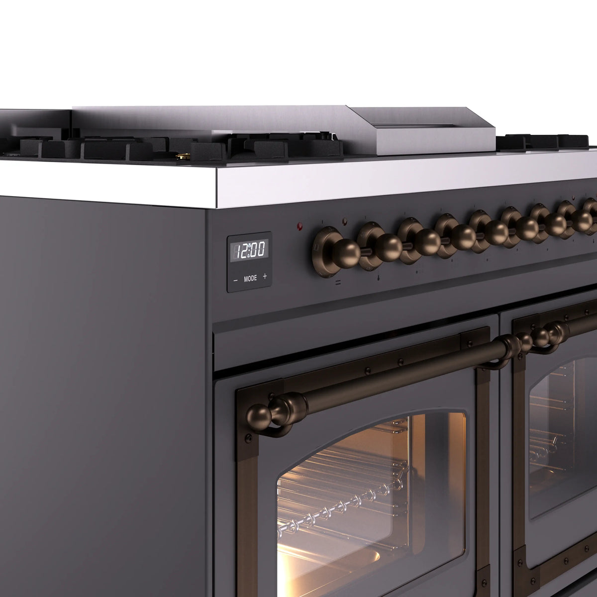 Matte graphite range close-up of bronze control knobs and oven triple glass door