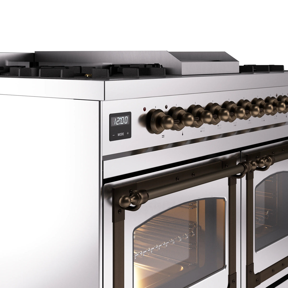 Stainless steel range front with brass knobs, burner grates, and bronze-trim oven doors