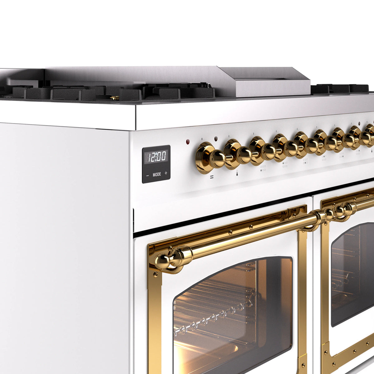 White dual fuel gas range close-up of brass control knobs and oven handle with glass door