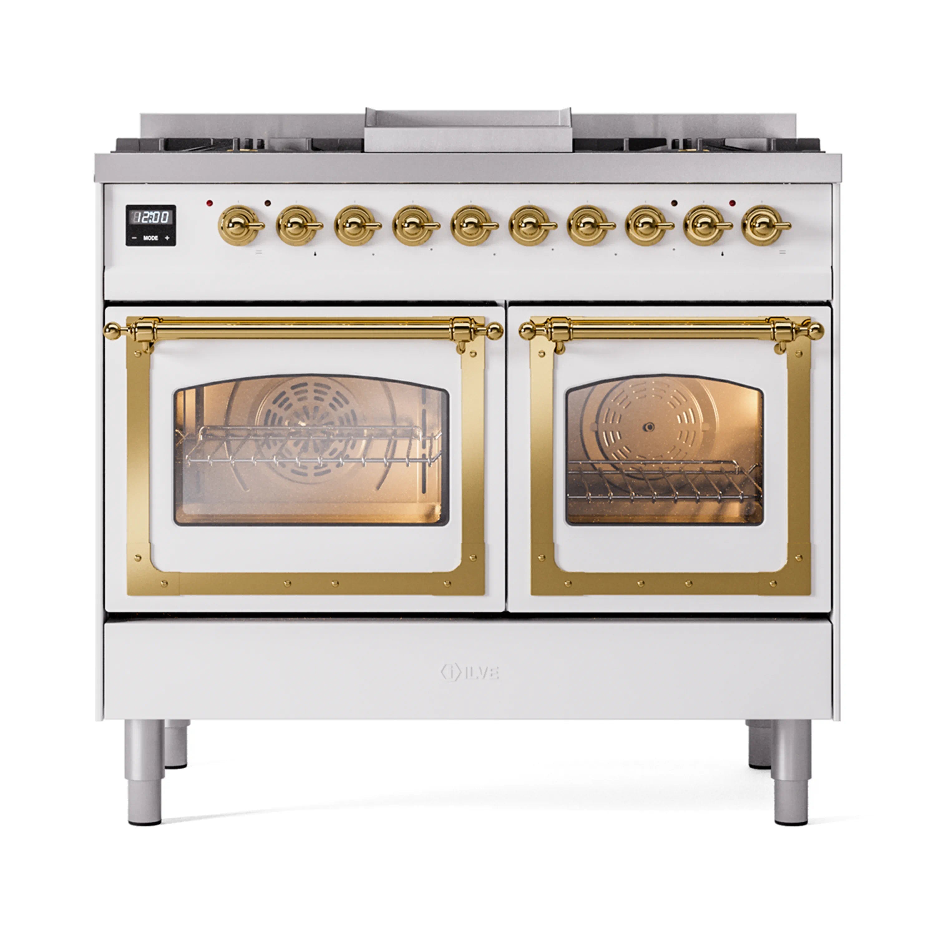 White dual fuel range with brass trim, triple-glass oven doors, and burner control panel.