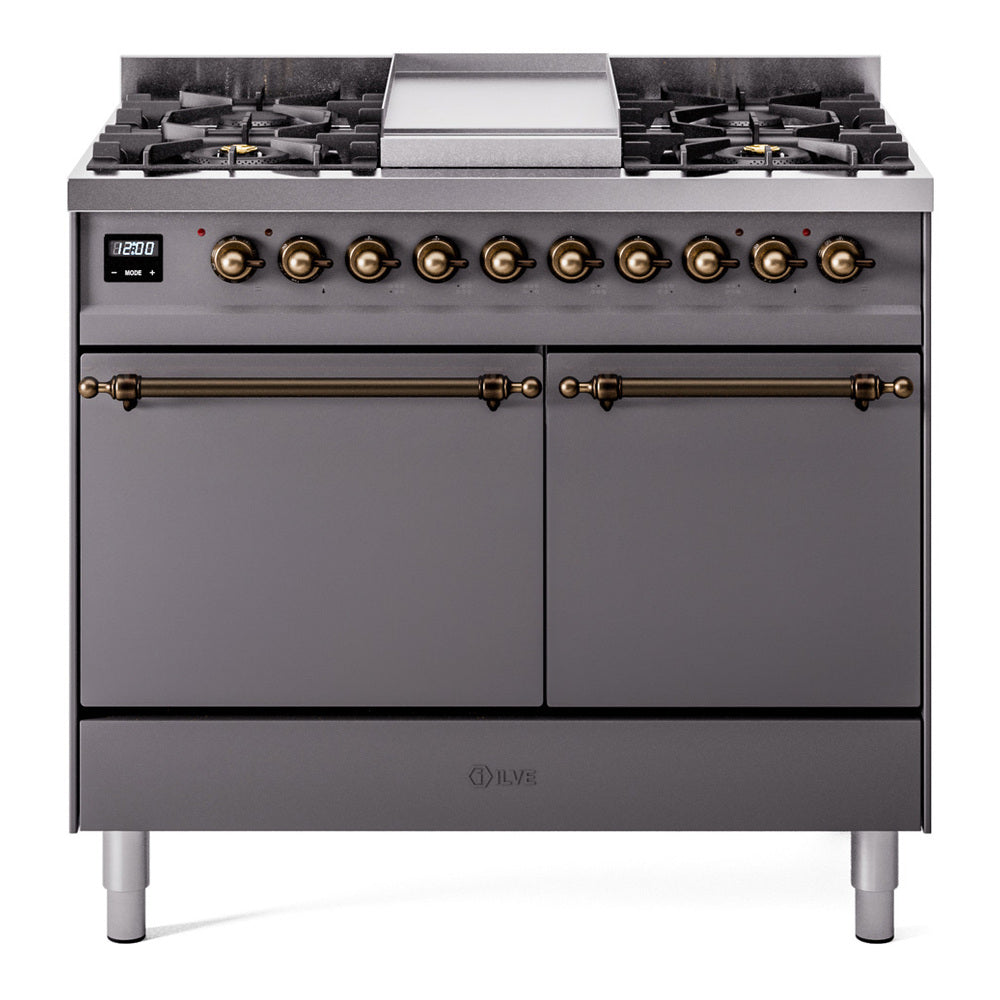 Matte graphite dual-fuel range front view with brass knobs, griddle, and two oven doors