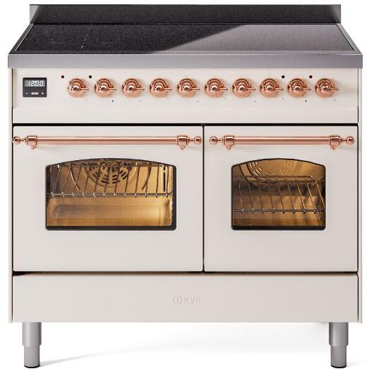 Freestanding induction range with both oven doors open, copper handles, antique white body