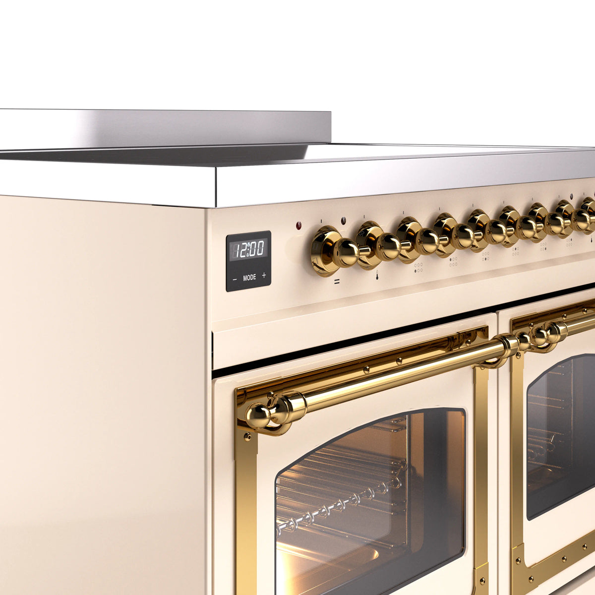 Antique white oven control area with brass knobs and arched brass oven handle