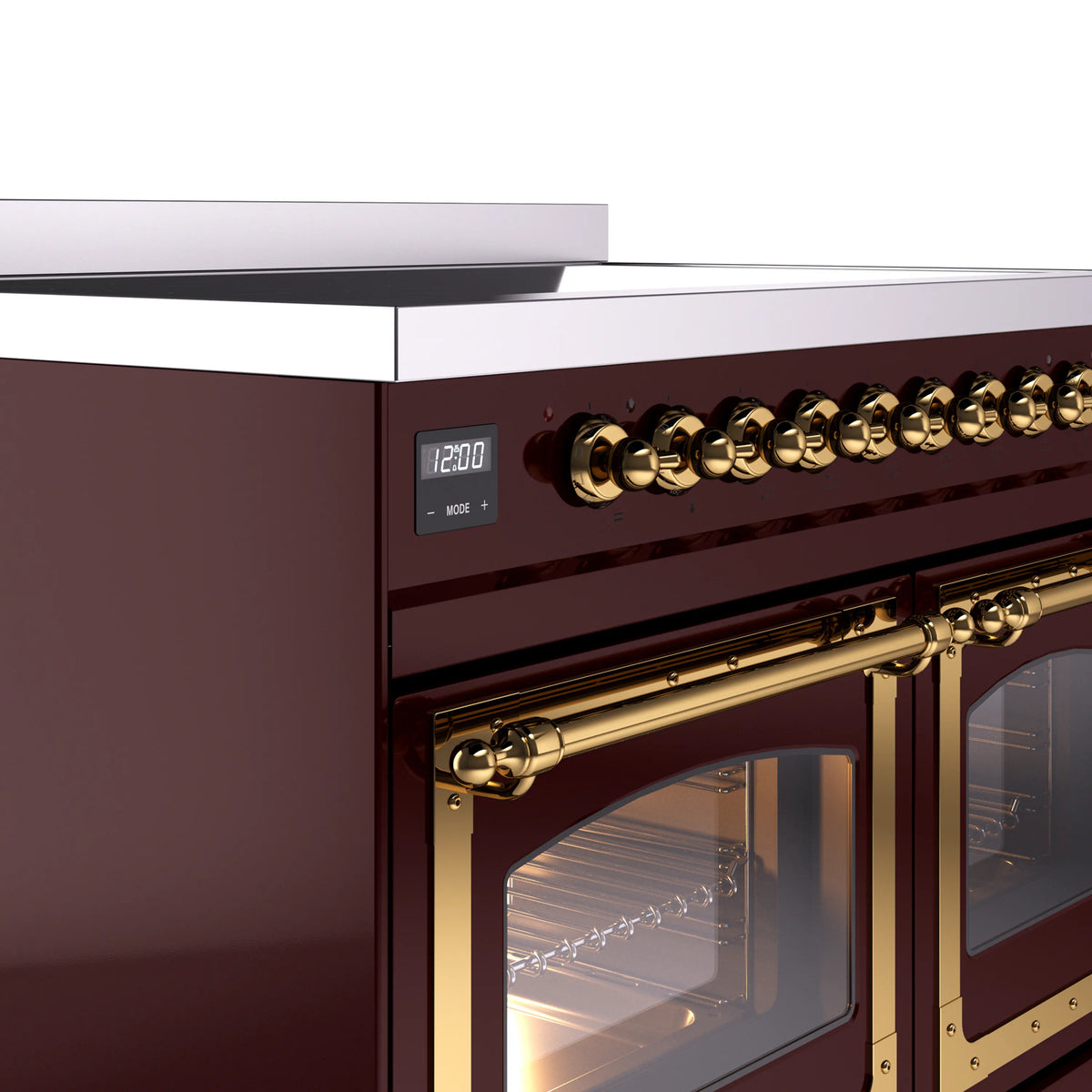 Burgundy induction range side control knobs with brass trim and oven door handle