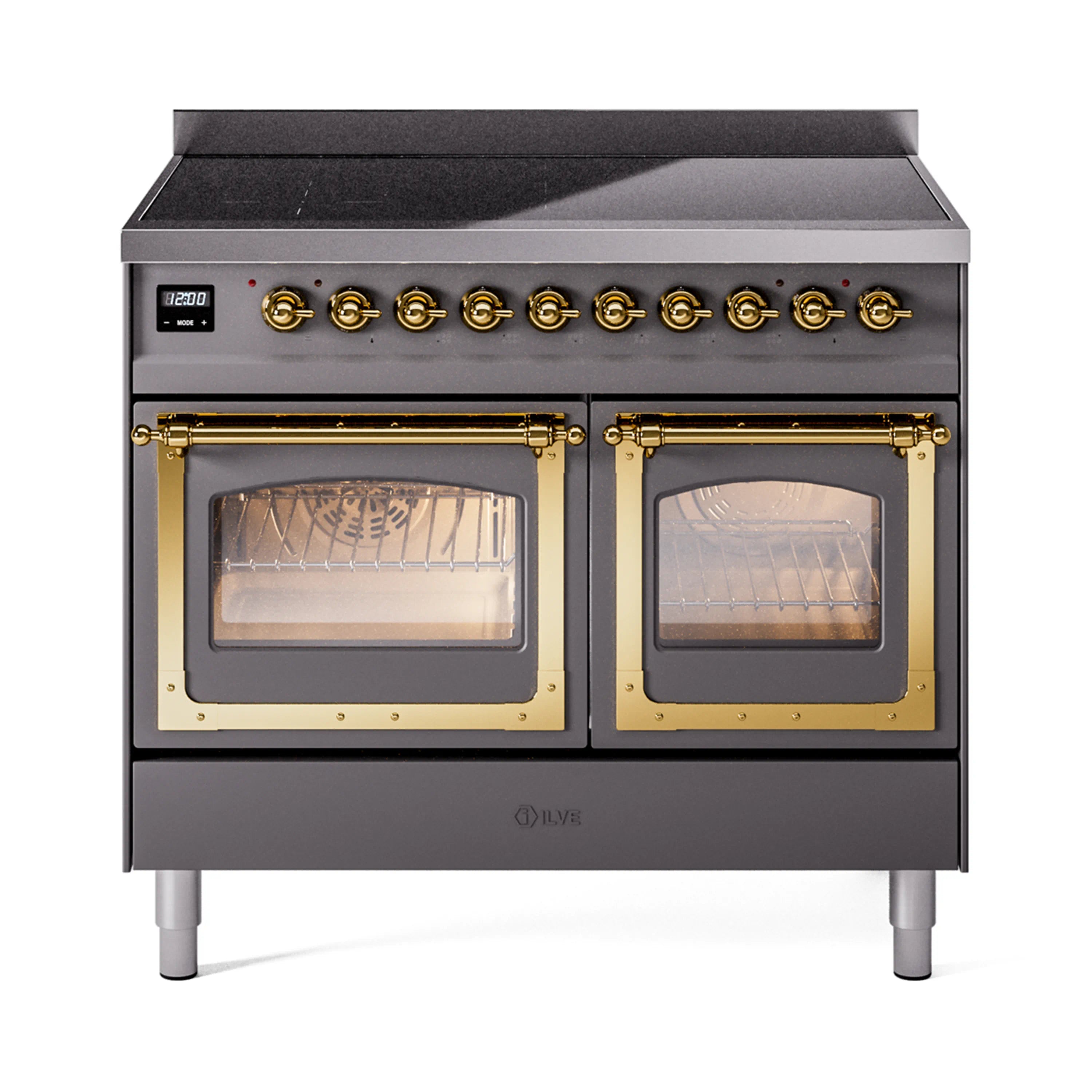 Matte graphite induction range with brass control knobs and brass-trimmed dual glass doors