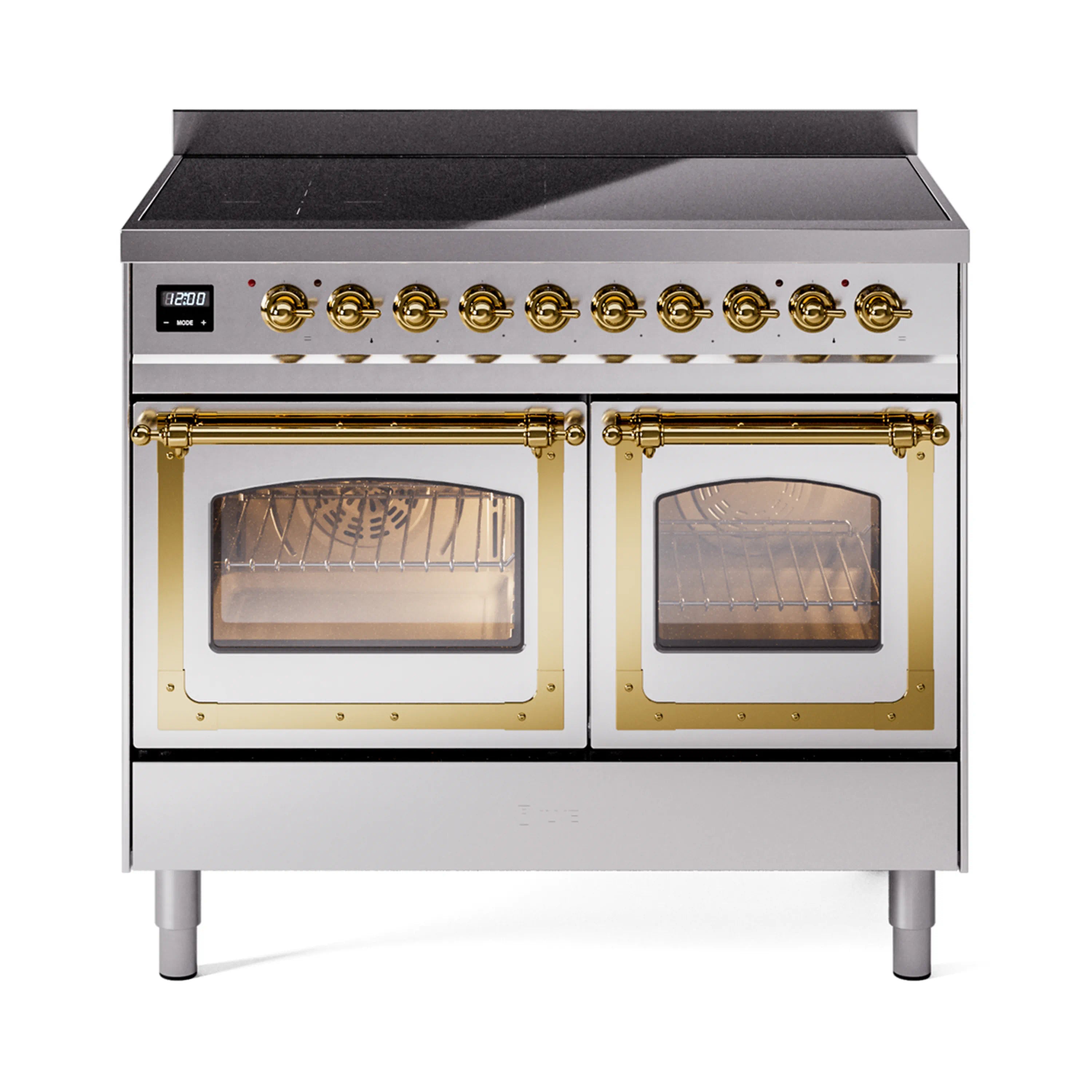 Stainless steel induction range with glass oven doors and brass control knobs